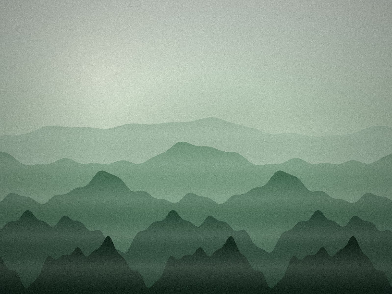 Layers of green hills thinning into mist