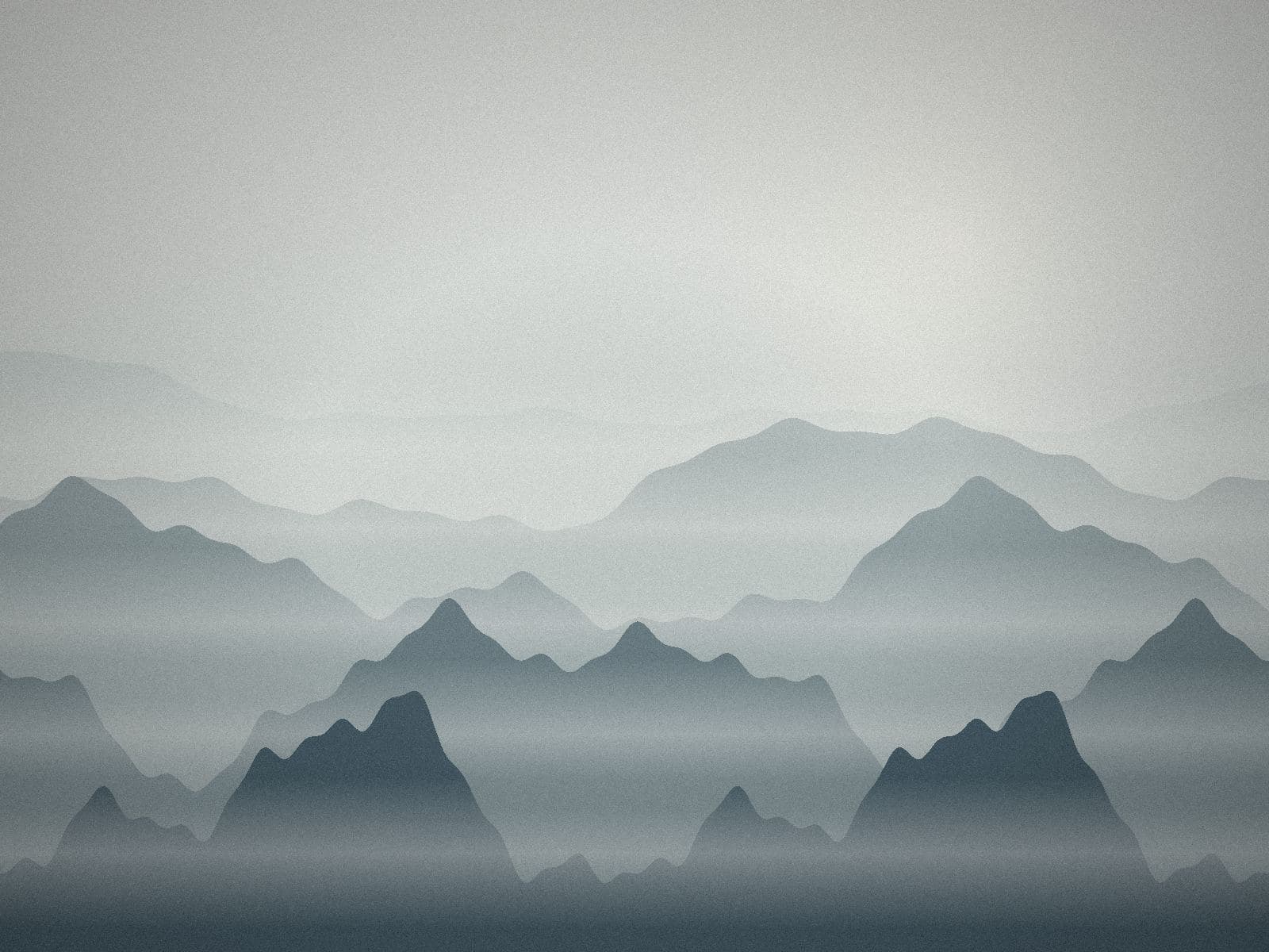 Ridgelines stepping back into a grey fog